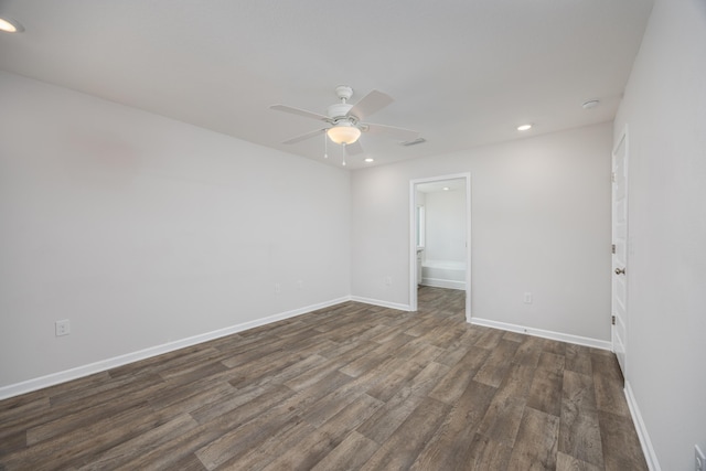 spare room with ceiling fan, dark wood finished floors, recessed lighting, and baseboards