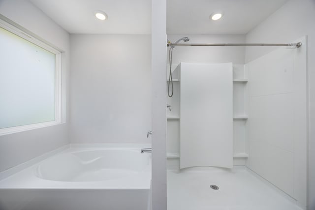 full bath featuring a garden tub, a shower, and recessed lighting