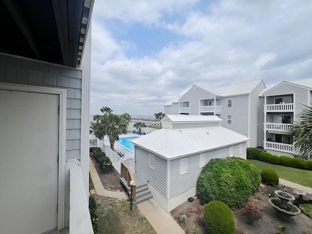 view of side of property featuring metal roof