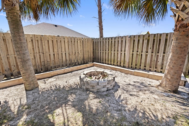 495 Brighton Cv, Freeport, FL 32439 - view of yard with a fire pit and fence