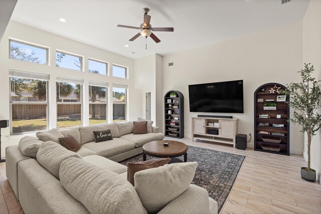 495 Brighton Cv, Freeport, FL 32439 - living area with ceiling fan, a high ceiling, recessed lighting, and light wood-style floors