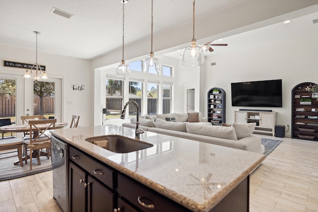 495 Brighton Cv, Freeport, FL 32439 - kitchen featuring a sink, stainless steel dishwasher, pendant lighting, a ceiling fan, and light stone counters