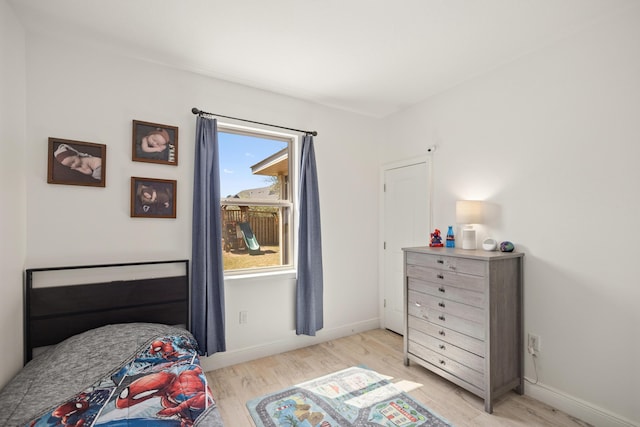 495 Brighton Cv, Freeport, FL 32439 - bedroom featuring light wood-type flooring and baseboards
