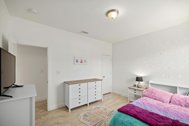 495 Brighton Cv, Freeport, FL 32439 - bedroom with light wood finished floors and baseboards