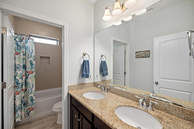 495 Brighton Cv, Freeport, FL 32439 - bathroom featuring toilet, shower / tub combo, double vanity, and wood finished floors
