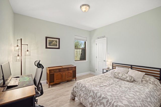 495 Brighton Cv, Freeport, FL 32439 - bedroom with light wood-type flooring, baseboards, and an office area
