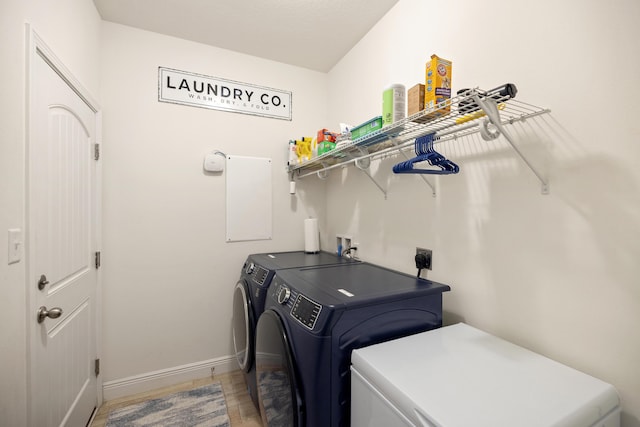 495 Brighton Cv, Freeport, FL 32439 - laundry area with washing machine and clothes dryer and baseboards