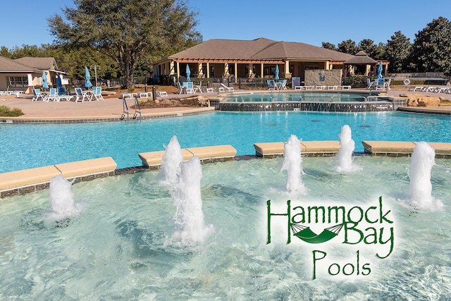 495 Brighton Cv, Freeport, FL 32439 - view of pool with a pool with connected hot tub, a patio, and fence