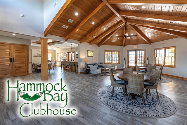 495 Brighton Cv, Freeport, FL 32439 - dining area featuring wooden ceiling, wood finished floors, baseboards, decorative columns, and plenty of natural light