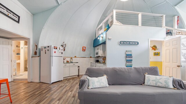 313 13th St, West Panama City Beach, FL 32413 - living area featuring high vaulted ceiling and wood finished floors