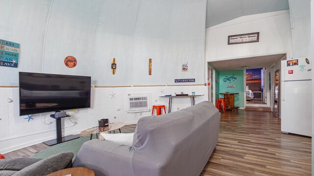 313 13th St, West Panama City Beach, FL 32413 - living area featuring high vaulted ceiling, wood finished floors, and a wall mounted air conditioner