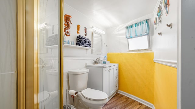 313 13th St, West Panama City Beach, FL 32413 - bathroom with toilet, wood finished floors, vanity, and an enclosed shower