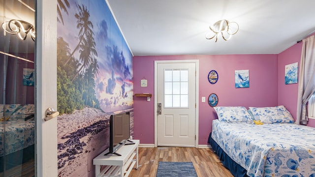 313 13th St, West Panama City Beach, FL 32413 - bedroom with wood finished floors and baseboards
