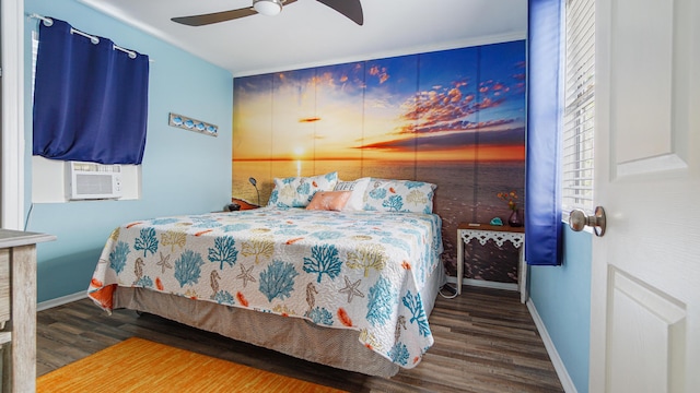 313 13th St, West Panama City Beach, FL 32413 - bedroom featuring baseboards, wood finished floors, cooling unit, and ceiling fan