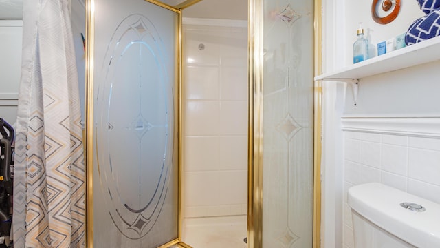 313 13th St, West Panama City Beach, FL 32413 - full bathroom with tile walls, a shower, and toilet