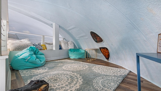 313 13th St, West Panama City Beach, FL 32413 - sitting room featuring vaulted ceiling and wood finished floors