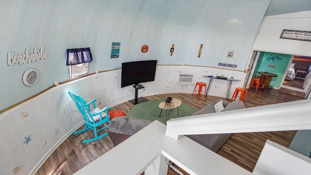 313 13th St, West Panama City Beach, FL 32413 - living room featuring wood finished floors, a wall mounted air conditioner, and baseboards