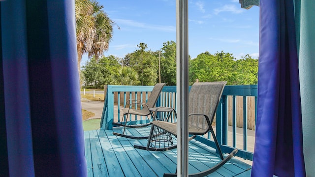 313 13th St, West Panama City Beach, FL 32413 - doorway featuring wood finished floors