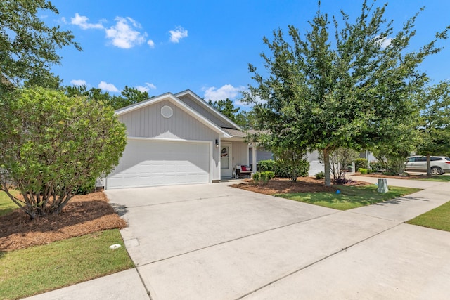 595 Earl Godwin Rd, Freeport, FL 32439 - view of front of property featuring concrete driveway and an attached garage