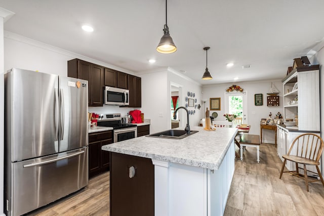 595 Earl Godwin Rd, Freeport, FL 32439 - kitchen featuring appliances with stainless steel finishes, a sink, light countertops, dark brown cabinets, and crown molding