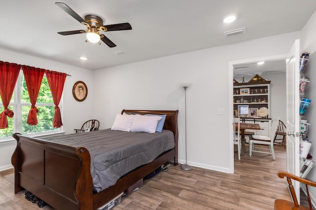 595 Earl Godwin Rd, Freeport, FL 32439 - bedroom with wood finished floors, baseboards, recessed lighting, and a ceiling fan