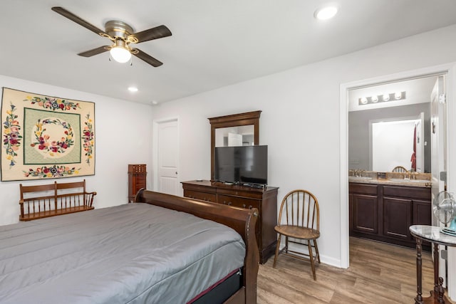 595 Earl Godwin Rd, Freeport, FL 32439 - bedroom featuring light wood-style flooring, connected bathroom, baseboards, recessed lighting, and ceiling fan