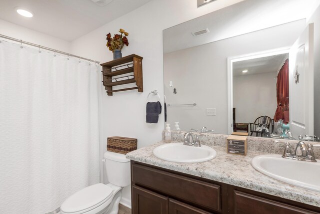 595 Earl Godwin Rd, Freeport, FL 32439 - full bathroom with double vanity, toilet, and a shower with curtain