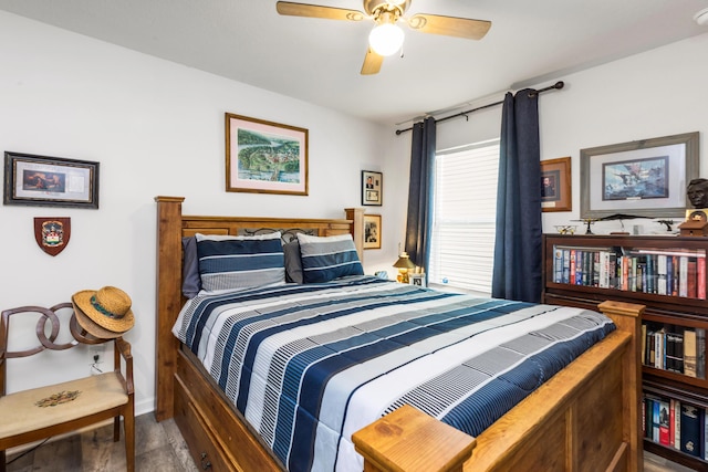 595 Earl Godwin Rd, Freeport, FL 32439 - bedroom featuring baseboards, a ceiling fan, and wood finished floors