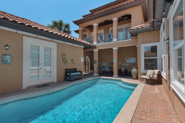 4701 Seastar Vis, Destin, FL 32541 - rear view of property featuring a balcony, french doors, stucco siding, and a tile roof