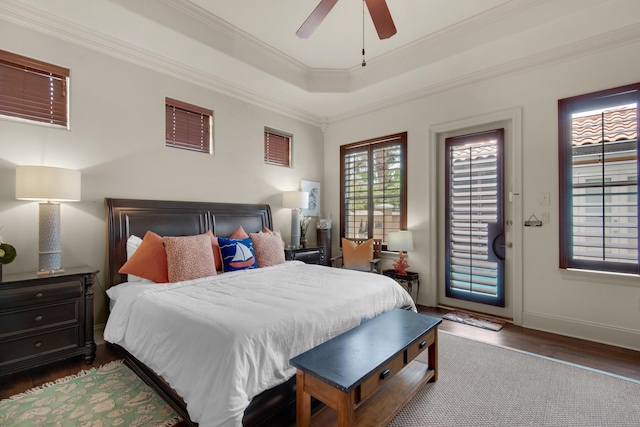 4701 Seastar Vis, Destin, FL 32541 - bedroom featuring wood finished floors, access to exterior, crown molding, a tray ceiling, and baseboards