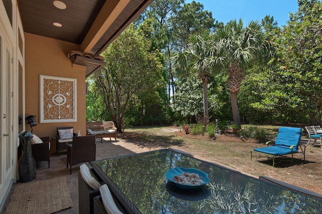 4701 Seastar Vis, Destin, FL 32541 - view of patio with an outdoor hangout area and view of scattered trees