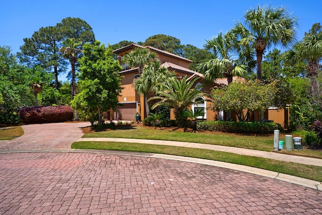 4701 Seastar Vis, Destin, FL 32541 - mediterranean / spanish-style home with decorative driveway, a tiled roof, and stucco siding