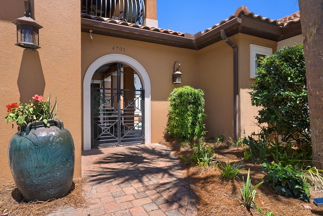 4701 Seastar Vis, Destin, FL 32541 - property entrance featuring a tile roof and stucco siding