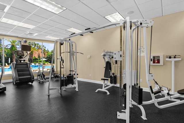 4701 Seastar Vis, Destin, FL 32541 - workout area featuring a drop ceiling and baseboards