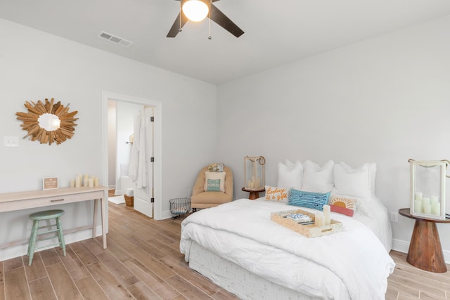 27 Cozy Cv, Freeport, FL 32439 - bedroom with wood finished floors, baseboards, and ceiling fan