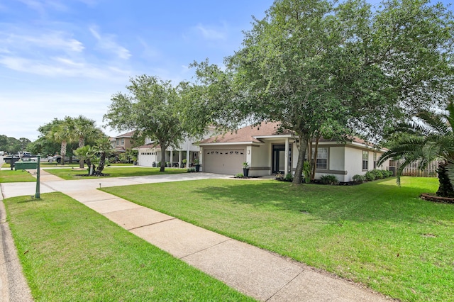 137 Loblolly Bay Dr, Santa Rosa Beach, FL 32459 - view of front facade with an attached garage, concrete driveway, stucco siding, and a front lawn