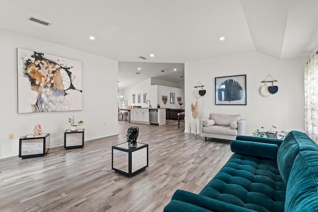 137 Loblolly Bay Dr, Santa Rosa Beach, FL 32459 - living room with light wood-style floors, vaulted ceiling, baseboards, and recessed lighting