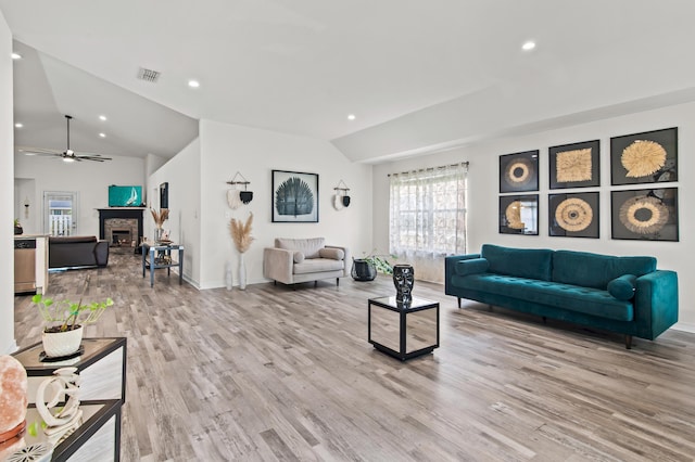137 Loblolly Bay Dr, Santa Rosa Beach, FL 32459 - living room featuring lofted ceiling, a fireplace, recessed lighting, light wood-type flooring, and plenty of natural light