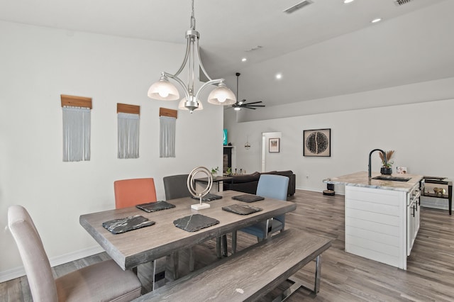 137 Loblolly Bay Dr, Santa Rosa Beach, FL 32459 - dining area with high vaulted ceiling, baseboards, ceiling fan, wood finished floors, and recessed lighting