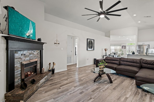 137 Loblolly Bay Dr, Santa Rosa Beach, FL 32459 - living area featuring ceiling fan, light wood finished floors, a fireplace, recessed lighting, and baseboards