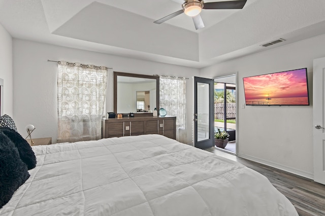 137 Loblolly Bay Dr, Santa Rosa Beach, FL 32459 - bedroom with access to outside, wood finished floors, a raised ceiling, ceiling fan, and baseboards
