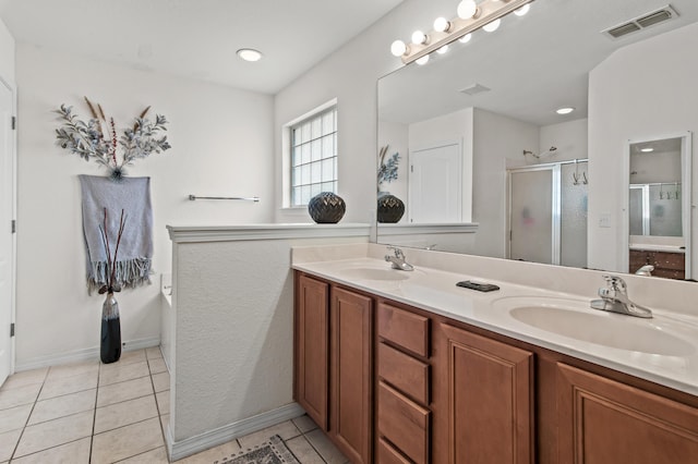 137 Loblolly Bay Dr, Santa Rosa Beach, FL 32459 - bathroom featuring double vanity, a stall shower, tile patterned floors, and baseboards