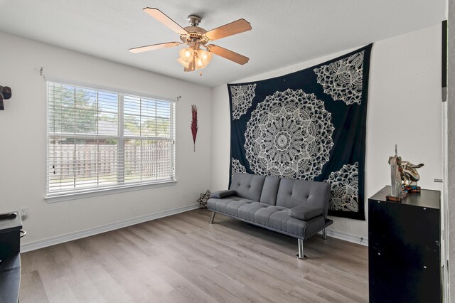 137 Loblolly Bay Dr, Santa Rosa Beach, FL 32459 - living area featuring wood finished floors, baseboards, and a ceiling fan