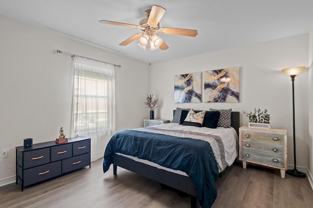 137 Loblolly Bay Dr, Santa Rosa Beach, FL 32459 - bedroom with wood finished floors, baseboards, and ceiling fan