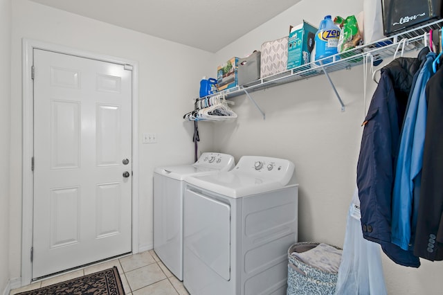 137 Loblolly Bay Dr, Santa Rosa Beach, FL 32459 - laundry area with washing machine and dryer and light tile patterned floors