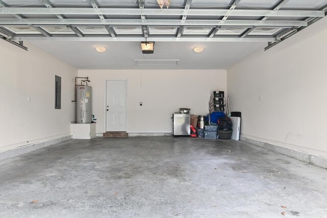 137 Loblolly Bay Dr, Santa Rosa Beach, FL 32459 - garage featuring water heater, a garage door opener, and electric panel