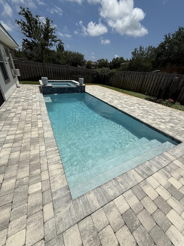 137 Loblolly Bay Dr, Santa Rosa Beach, FL 32459 - view of swimming pool with a patio, a fenced backyard, and a pool with connected hot tub