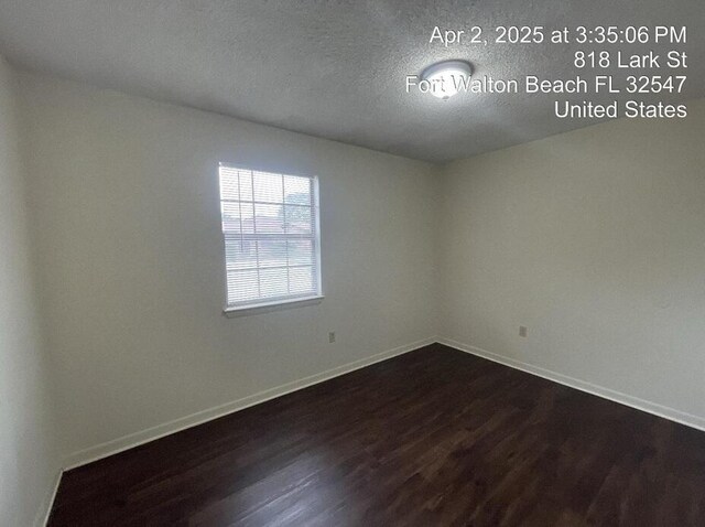 818 Lark St Unit 1, 2, 3, 4, Fort Walton Beach, FL 32547 - empty room with dark wood-style floors and a textured ceiling
