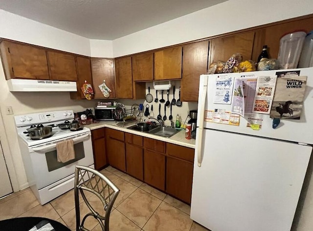 818 Lark St Unit 1, 2, 3, 4, Fort Walton Beach, FL 32547 - kitchen featuring white appliances, under cabinet range hood, light countertops, and light tile patterned floors
