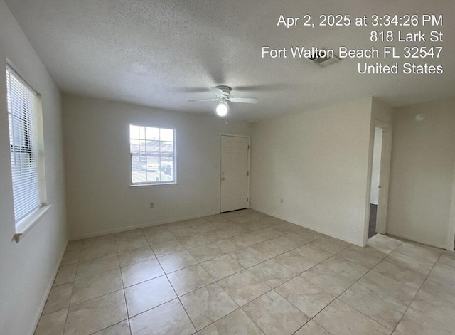 818 Lark St Unit 1, 2, 3, 4, Fort Walton Beach, FL 32547 - unfurnished room with a ceiling fan, a textured ceiling, and light tile patterned floors